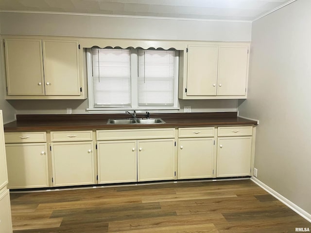905 W Boulevard St, Marion, IL 62959 - kitchen with dark countertops, crown molding, wood finished floors, and cream cabinets
