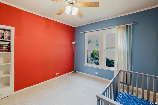 1506 E Oak St, West Frankfort, IL 62896 - unfurnished bedroom with carpet, crown molding, a crib, and a ceiling fan