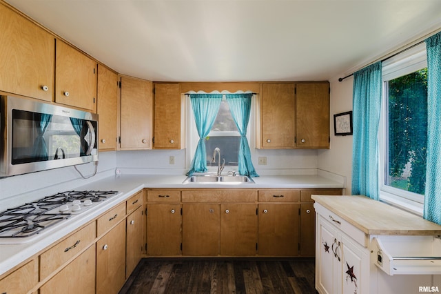 1506 E Oak St, West Frankfort, IL 62896 - kitchen with stainless steel microwave, white gas stovetop, dark wood-style flooring, and light countertops
