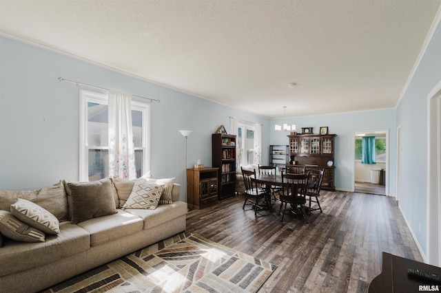 1506 E Oak St, West Frankfort, IL 62896 - living room featuring dark wood-style flooring and a chandelier