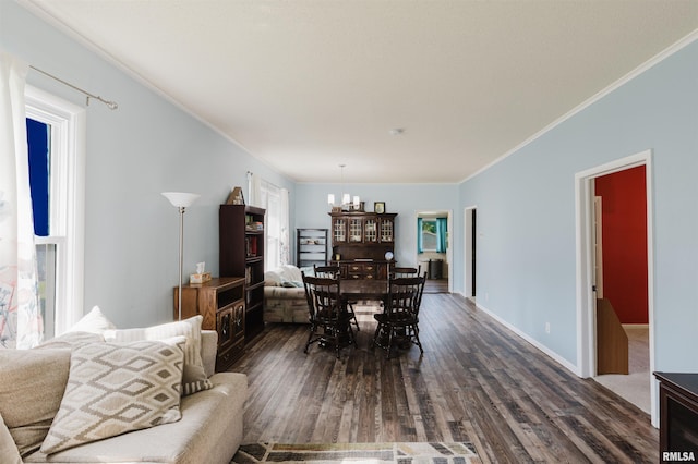 1506 E Oak St, West Frankfort, IL 62896 - dining area featuring dark wood finished floors, ornamental molding, healthy amount of natural light, and a chandelier