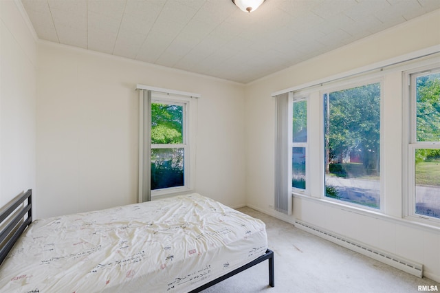 1506 E Oak St, West Frankfort, IL 62896 - bedroom featuring baseboard heating, multiple windows, crown molding, and light carpet