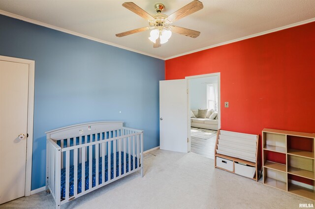 1506 E Oak St, West Frankfort, IL 62896 - carpeted bedroom with crown molding, a nursery area, and a ceiling fan
