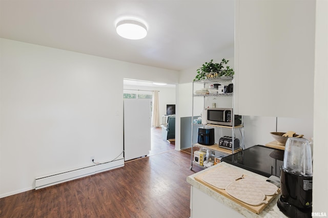 103 Westernaire Dr, Marion, IL 62959 - office space featuring a baseboard heating unit and wood finished floors