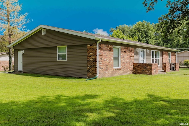 103 Westernaire Dr, Marion, IL 62959 - view of side of property with brick siding and a lawn