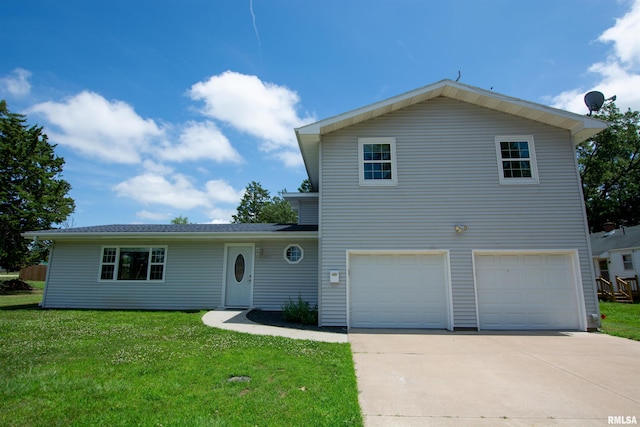 1008 5th Ave, Camanche, IA 52730 - view of front of property with an attached garage, concrete driveway, and a front lawn
