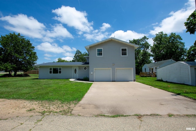 1008 5th Ave, Camanche, IA 52730 - view of front facade featuring an attached garage, driveway, and a front lawn