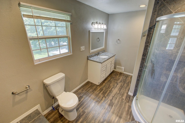 1008 5th Ave, Camanche, IA 52730 - bathroom with vanity, wood finished floors, and a shower stall