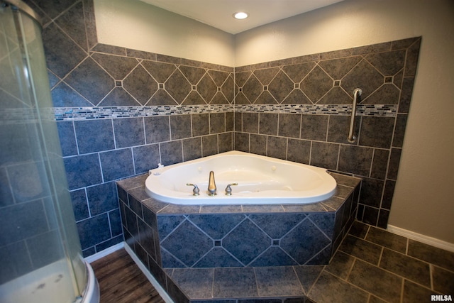 1008 5th Ave, Camanche, IA 52730 - bathroom featuring a garden tub, a shower stall, recessed lighting, and wood finished floors