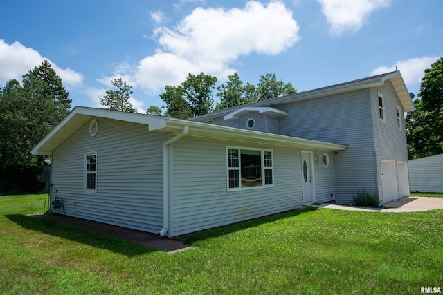 1008 5th Ave, Camanche, IA 52730 - view of front of property with a front lawn, a garage, and driveway