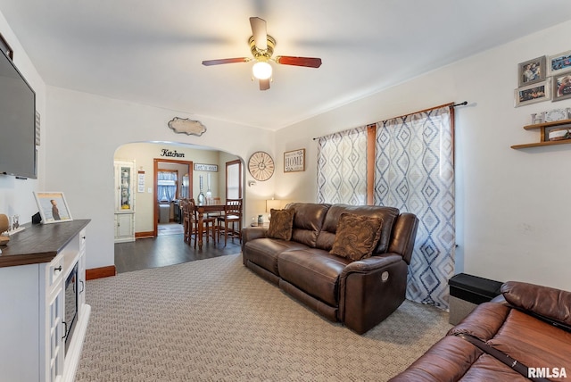 240 15th Ave, East Moline, IL 61244 - living room with arched walkways, ceiling fan, and wood finished floors