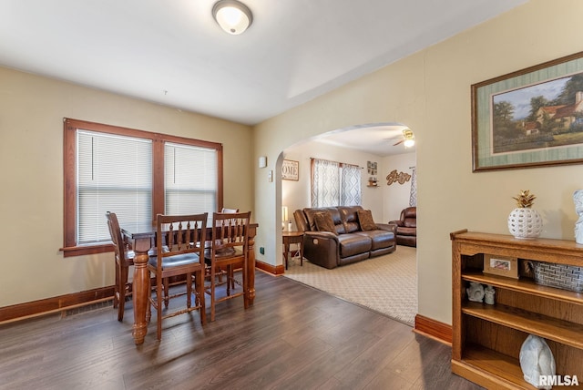 240 15th Ave, East Moline, IL 61244 - dining space with arched walkways and dark wood-type flooring