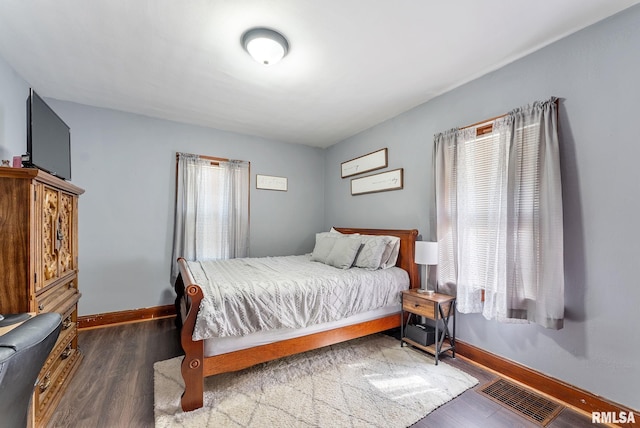 240 15th Ave, East Moline, IL 61244 - bedroom with wood finished floors and baseboards