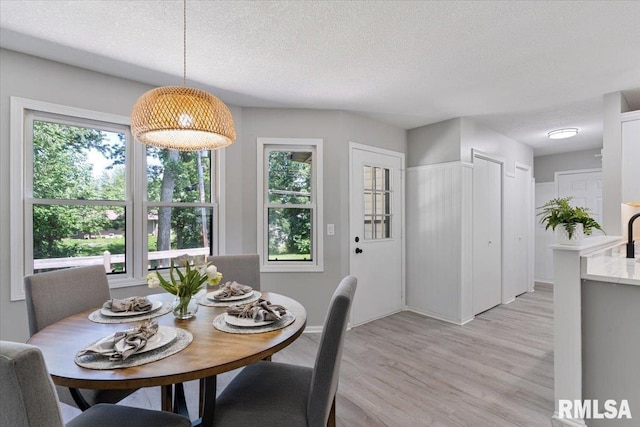 4050 4th St Unit B, East Moline, IL 61244 - dining space featuring a textured ceiling and light wood-type flooring