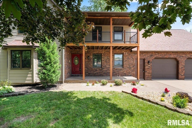 4050 4th St Unit B, East Moline, IL 61244 - view of front of property with a balcony, concrete driveway, a front yard, a porch, and a garage