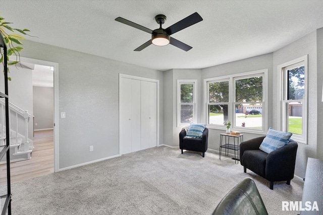 4050 4th St Unit B, East Moline, IL 61244 - living area with a ceiling fan, stairs, carpet flooring, and a textured ceiling
