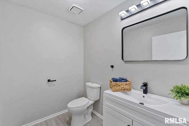 4050 4th St Unit B, East Moline, IL 61244 - half bathroom with wood finished floors and vanity