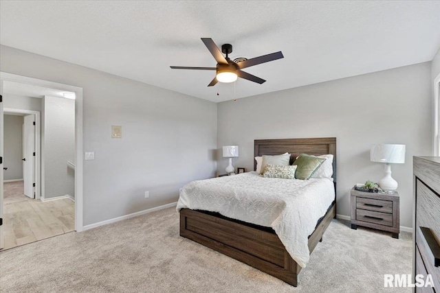 4050 4th St Unit B, East Moline, IL 61244 - carpeted bedroom featuring baseboards and a ceiling fan