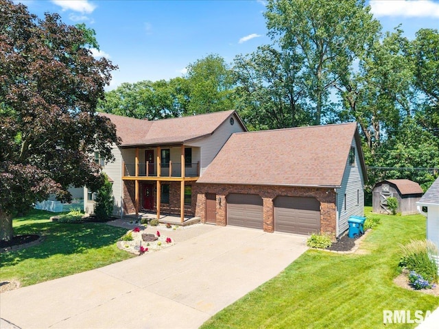 4050 4th St Unit B, East Moline, IL 61244 - view of front of property with a balcony, an attached garage, concrete driveway, brick siding, and a shingled roof