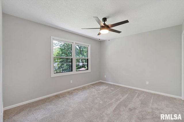 4050 4th St Unit B, East Moline, IL 61244 - empty room with ceiling fan, carpet floors, and a textured ceiling
