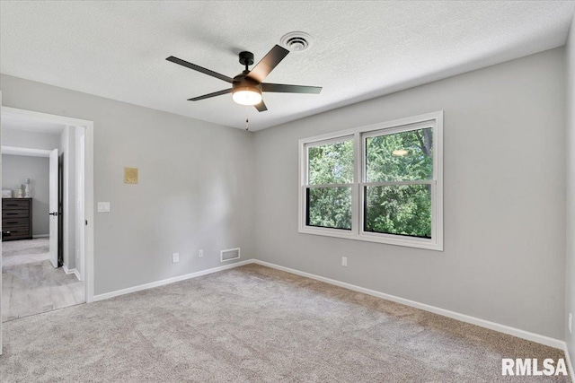 4050 4th St Unit B, East Moline, IL 61244 - carpeted empty room with ceiling fan and a textured ceiling