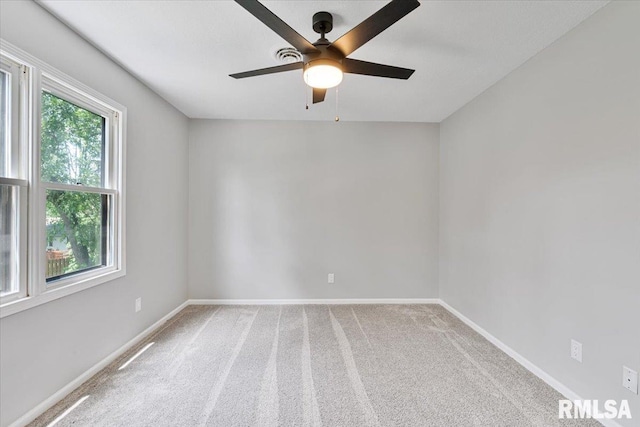 4050 4th St Unit B, East Moline, IL 61244 - carpeted spare room with a ceiling fan and baseboards