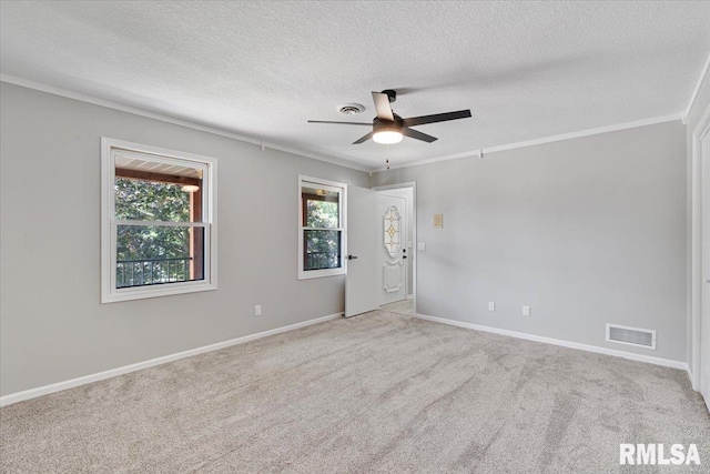 4050 4th St Unit B, East Moline, IL 61244 - empty room featuring a textured ceiling, a ceiling fan, carpet, and ornamental molding