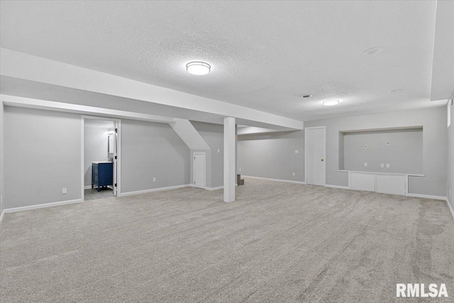4050 4th St Unit B, East Moline, IL 61244 - finished basement featuring a textured ceiling and carpet floors