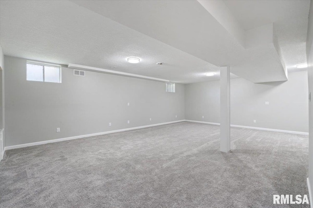 4050 4th St Unit B, East Moline, IL 61244 - below grade area with carpet floors and a textured ceiling