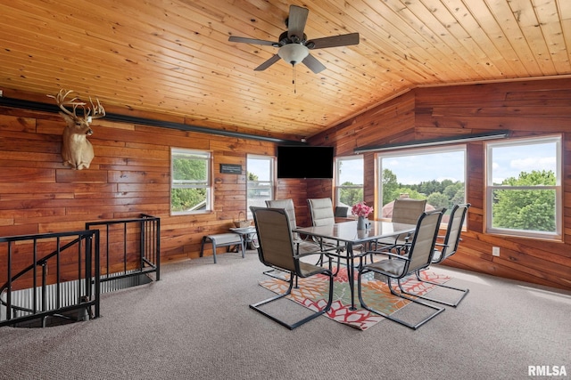 910 Fyre Lake Dr, Sherrard, IL 61281 - carpeted dining area with wooden walls, lofted ceiling, ceiling fan, and wood ceiling