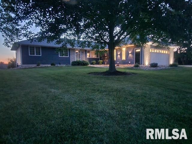 910 Fyre Lake Dr, Sherrard, IL 61281 - view of front facade featuring a front lawn and a garage