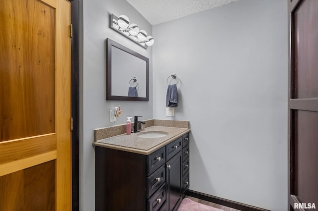 910 Fyre Lake Dr, Sherrard, IL 61281 - bathroom with vanity and a textured ceiling