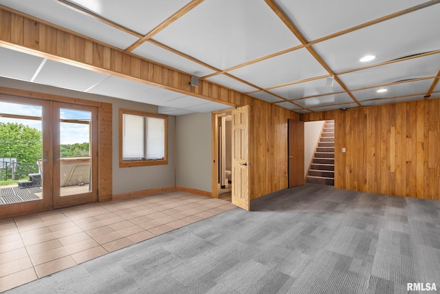 910 Fyre Lake Dr, Sherrard, IL 61281 - below grade area with recessed lighting, stairway, wood walls, tile patterned flooring, and carpet