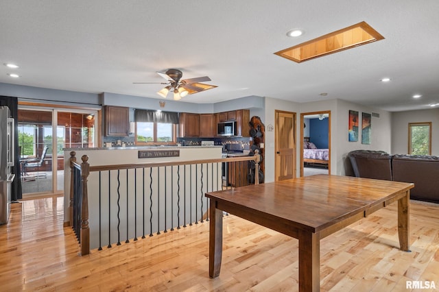 910 Fyre Lake Dr, Sherrard, IL 61281 - dining room with recessed lighting, light wood finished floors, ceiling fan, and a textured ceiling
