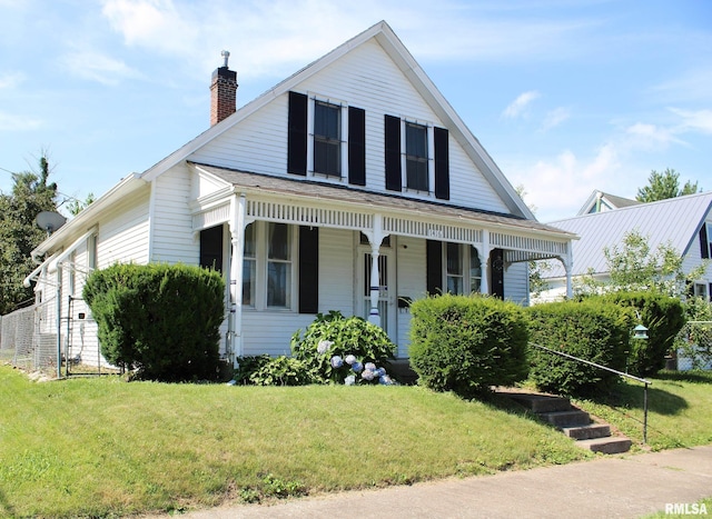 1416 Payson Ave, Quincy, IL 62301 - view of front of home with a chimney, a porch, and a front lawn