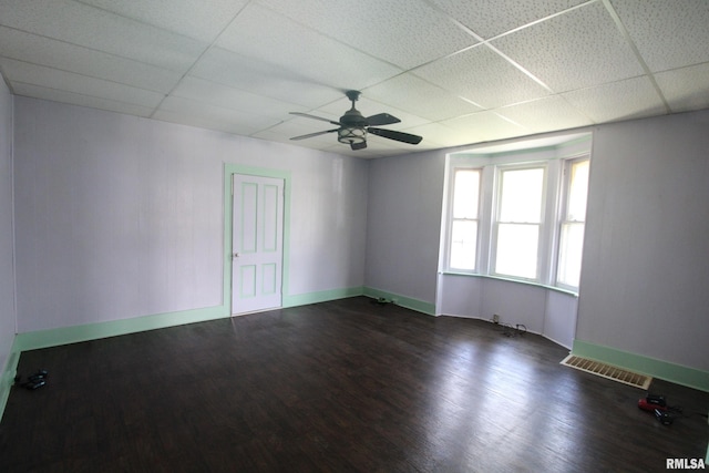 1416 Payson Ave, Quincy, IL 62301 - unfurnished room featuring a drop ceiling, dark wood-type flooring, and a ceiling fan