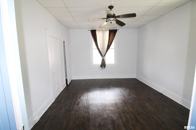 1416 Payson Ave, Quincy, IL 62301 - empty room with dark wood-style flooring, ceiling fan, and a drop ceiling