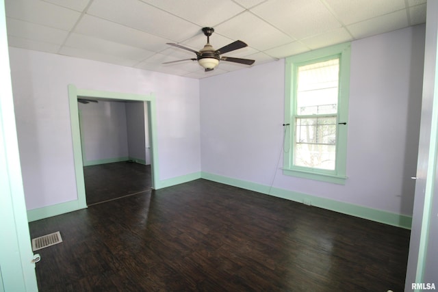 1416 Payson Ave, Quincy, IL 62301 - empty room featuring a paneled ceiling, ceiling fan, and dark wood-style floors