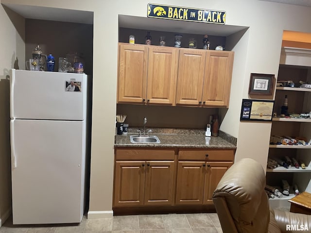 1175 Rustic View Ct, Eldridge, IA 52748 - kitchen with freestanding refrigerator and dark countertops