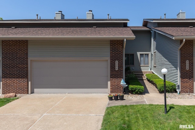 4554 Bunker Hill Dr, Bettendorf, IA 52722 - view of front facade featuring brick siding, driveway, a chimney, roof with shingles, and an attached garage
