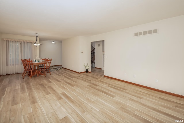 4554 Bunker Hill Dr, Bettendorf, IA 52722 - dining room with light wood-type flooring and baseboards