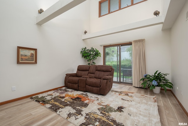 4554 Bunker Hill Dr, Bettendorf, IA 52722 - living area featuring wood finished floors and a towering ceiling