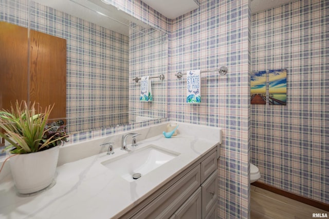 4554 Bunker Hill Dr, Bettendorf, IA 52722 - bathroom with vanity and wallpapered walls