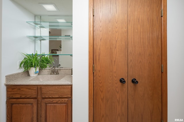 4554 Bunker Hill Dr, Bettendorf, IA 52722 - bathroom featuring vanity and a closet