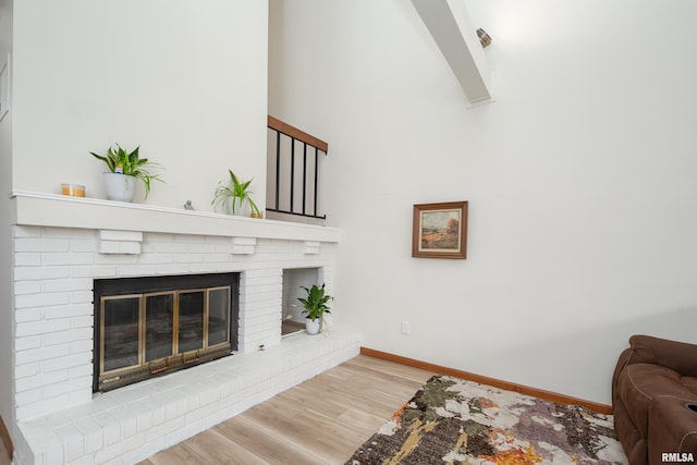 4554 Bunker Hill Dr, Bettendorf, IA 52722 - living room featuring wood finished floors and a fireplace