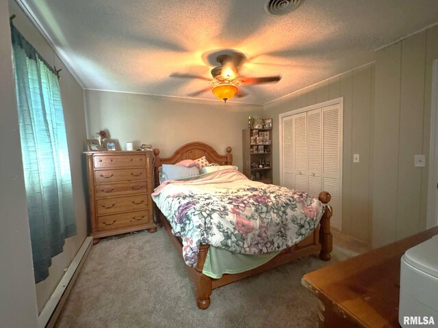 502 S Day St, West Frankfort, IL 62896 - bedroom with light carpet, a closet, a textured ceiling, and a ceiling fan