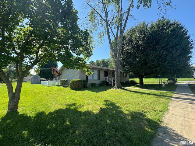 502 S Day St, West Frankfort, IL 62896 - view of front facade with a front lawn and a shed