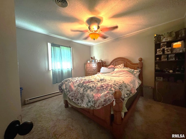 502 S Day St, West Frankfort, IL 62896 - bedroom featuring baseboard heating, carpet floors, a textured ceiling, and ceiling fan