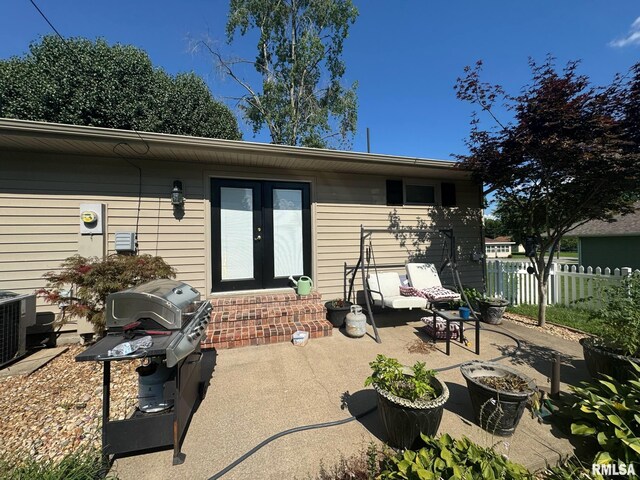 502 S Day St, West Frankfort, IL 62896 - rear view of property with french doors, a patio area, and an outdoor fire pit