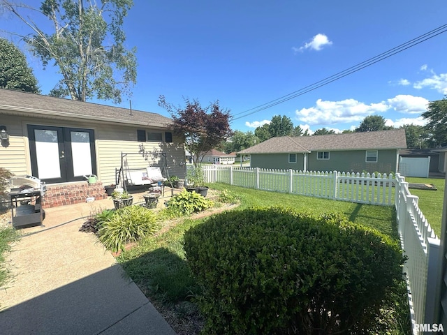 502 S Day St, West Frankfort, IL 62896 - fenced backyard featuring french doors, a patio area, and a storage shed